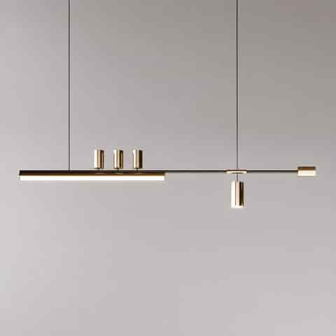 Full view of minimalist black and gold linear LED pendant with asymmetric bar design and cylindrical spotlights